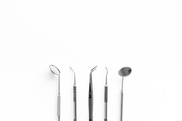 Dentist work desk with tools for teeth on white background top view mock up