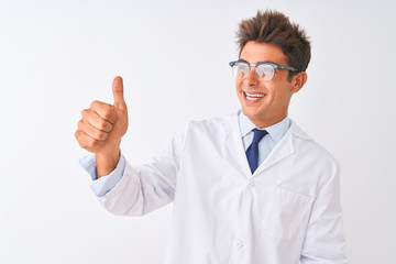 Young handsome sciencist man wearing glasses and coat over isolated white background Looking proud, smiling doing thumbs up gesture to the side