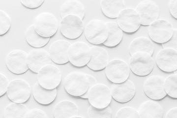 pattern of cosmetic cotton pads on white background top view