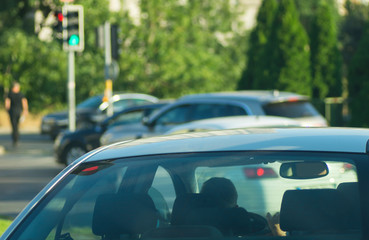 Cars waiting in traffic light at a crossroad in İstanbul, crowded heavy traffic during red light waiting for green light