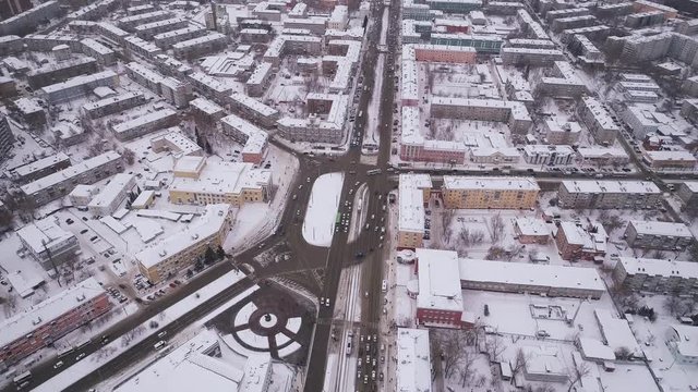 Aerial of bridge and car driving on the bridge, winter sunny day in Barnaul, Siberia, Russia.