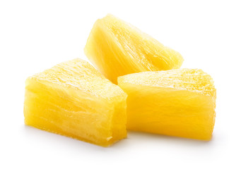 Canned pineapple chunks. Pineapple slices isolated. Canned pineapple pieces.