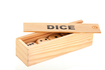 Dices in wooden box solated over white background