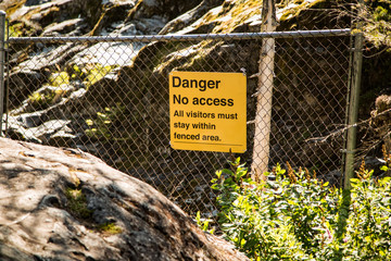 Sign Danger No Access visitor must stay within fenced area