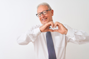 Senior grey-haired businessman wearing tie and glasses over isolated white background smiling in love showing heart symbol and shape with hands. Romantic concept.