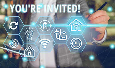 Word writing text You Re Invited. Business photo showcasing make a polite friendly request to someone go somewhere Female human wear formal work suit presenting presentation use smart device