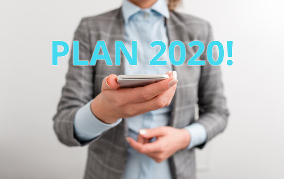 Word writing text Plan 2020. Business photo showcasing detailed proposal for doing or achieving something next year Business concept with mobile phone and business woman