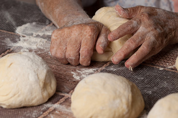 Woman making dought.Dought for pizza and bread.Food