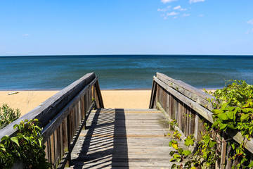 Walkway leading to Ocean View Beach in Norfolk, Virginia with the Chesapeake Bay in the background. - Powered by Adobe