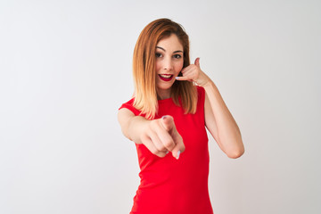 Redhead businesswoman wearing elegant red dress standing over isolated white background smiling...