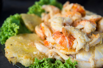 Traditional Bahian seafood dish of stewed pineapple, lobster and shrimp served at a beachside shack in Brazil