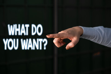Text sign showing What Do You Want Question. Business photo showcasing say or write in order to ask demonstrating about something Finger pointing in the Dark with hand pointing in the copy space