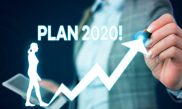 Writing note showing Plan 2020. Business concept for detailed proposal for doing or achieving something next year Female human wear formal work suit presenting smart device