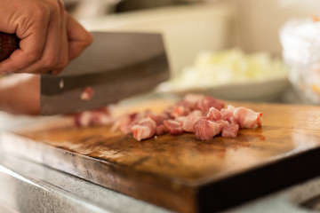 cut raw pork on wooden table