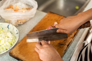 cut raw pork on wooden table