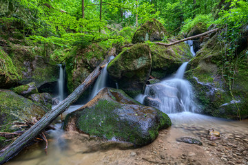 Water streaming over rocky cascades along famous Gertelbach waterfalls, Black Forest, Germany