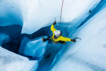 Poster Im Rahmen Ice climber on piller inside vertical ice cave on the Matanuska Glacier. © DCrane Photography