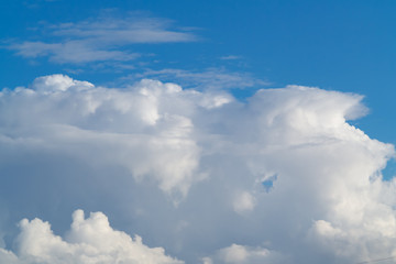 beautiful white cumulus clouds in the blue sky during the day
