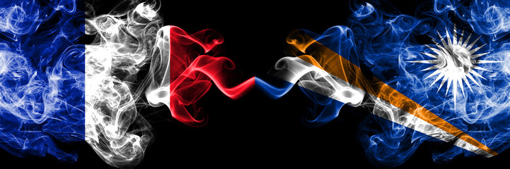 France vs Marshall Islands smoky mystic flags placed side by side. Thick colored silky abstract...