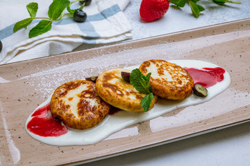 cheesecakes from cottage cheese on grey background