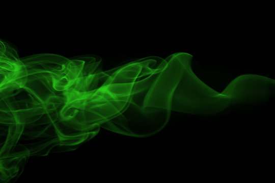 Movement of green smoke abstract on black backgroud
