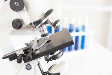 Microscopes and scientific test tubes in the laboratory.
