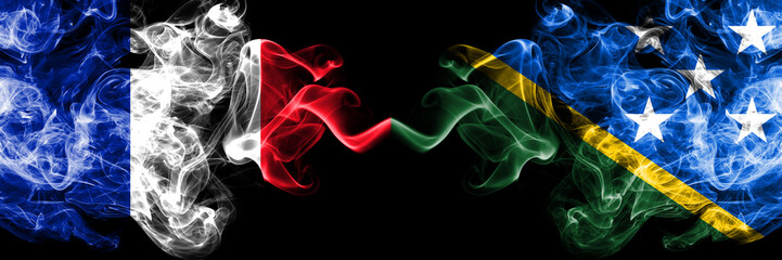 France vs Solomon Islands smoky mystic flags placed side by side. Thick colored silky abstract...