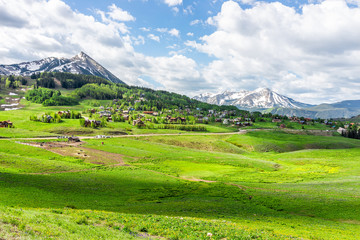 Crested Butte, Colorado Snodgrass hiking trail in summer with alpine meadows and mountain view and town village