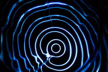 Sound waves in the dark. Blue color