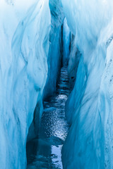 Curving walls of water-filled crevasse deep inside the Matanuska Glacier.