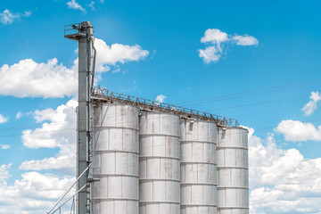 Vintage old industrial tank in Colorado in historic town isolated against blue sky