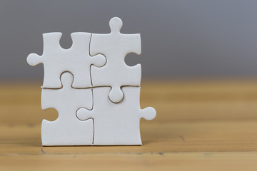 Businessmen put the last puzzle piece, business service concept to success.