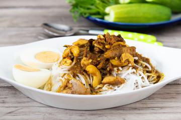 Thai Rice Vermicelli with Kaeng Pung (Tai) Pla Nam Khon (Fish Kidney Thick Spicy Soup).