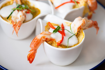 Steamed Seafood Curry Cakes with coconut cream and Prawn.