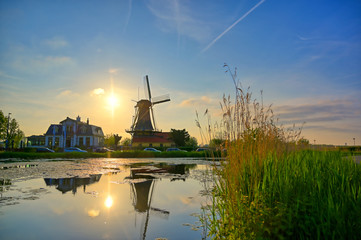 Fototapeta na wymiar Historic windmills located in Kralingen Lake in Rotterdam, the Netherlands.