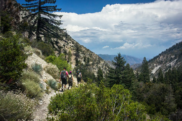 Hikers Travel Towards Storm © Brian Swanson