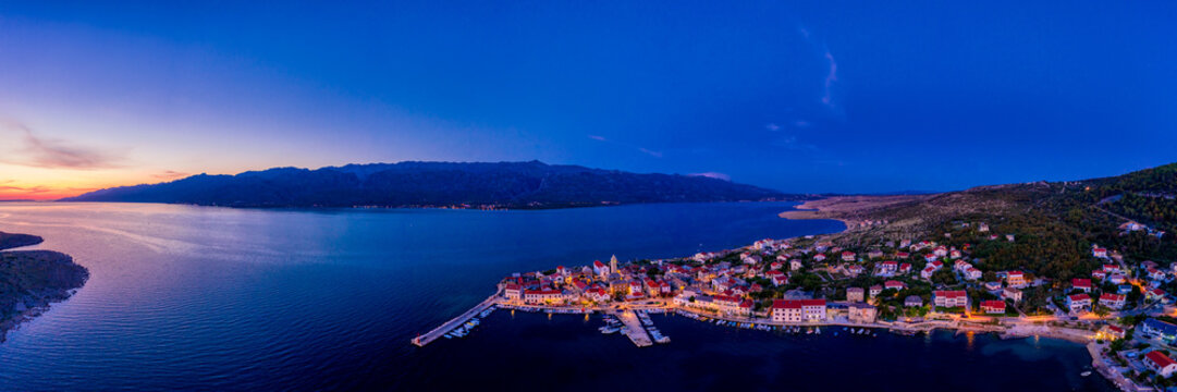 Sunset over town in Croatia, aerial panorama of Vinjerac, near Zadar