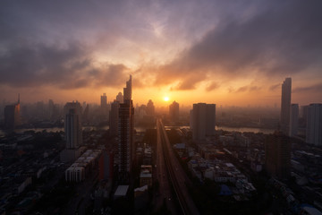 sunrise skyline cityscape on taksin bridge in bangkok