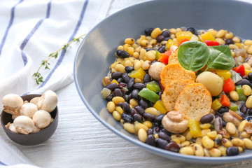 Tasty soup with legumes in bowl on table, closeup