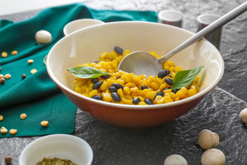 Bowl with tasty boiled legumes on table