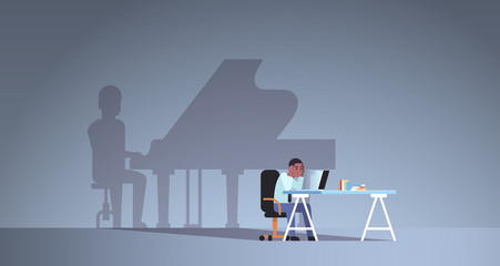 Fototapeta premium african american man sitting at workplace using laptop shadow of man playing piano imagination aspiration concept male cartoon character flat horizontal full length