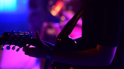 Guitarist playing guitar during an architectural college fest in Kerala.