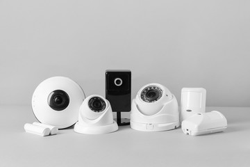 Different equipment of security system on grey background