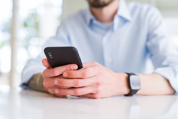 Close up of business man working using smartphone