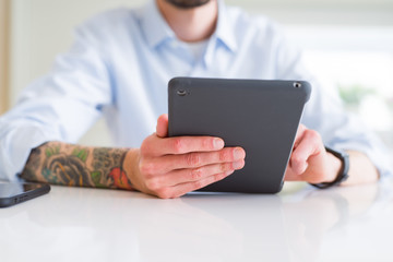 Close up of business man working using touchpad tablet