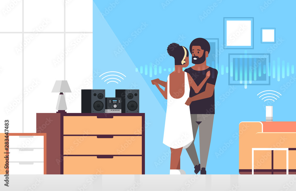 Poster couple using hi-fi stereo system controlled by smart speaker voice recognition activated assistant s