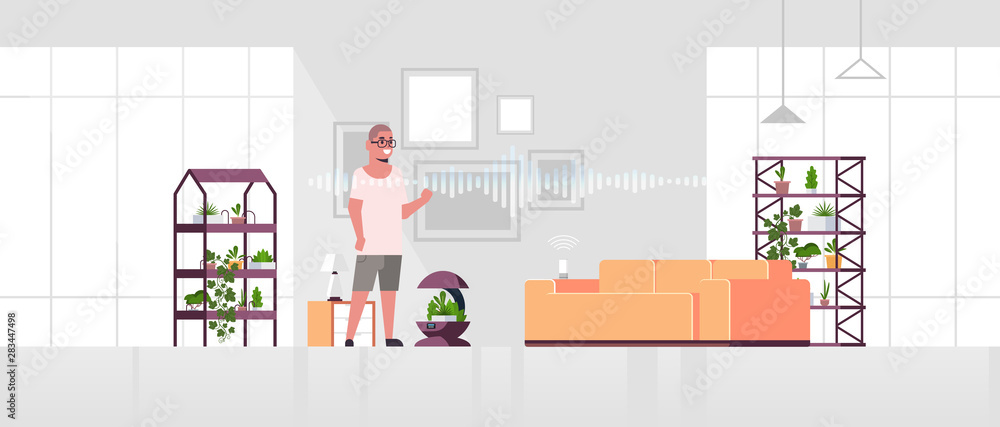 Poster man using auto watering system controlled by smart speaker voice recognition activated digital assis
