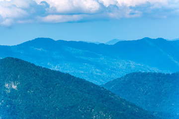 Layers of mountains in the haze and fog.