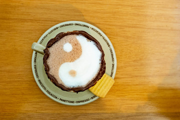 Hot chocolate with ying yang drawing and chocolate border