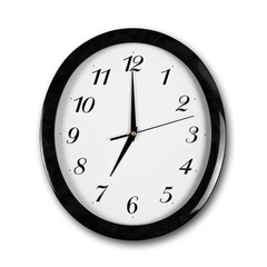 Large round white wall clock with black frame. The hands point to 7 o'clock. Close up. Isolated on white background